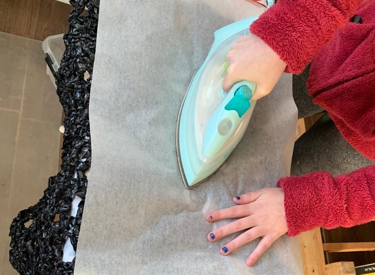 A person ironing